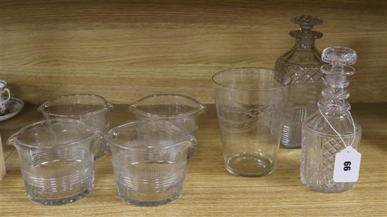 A quantity of cut glass to incorporate four glass coolers, two decanters and an engraved glass tallest 9cm